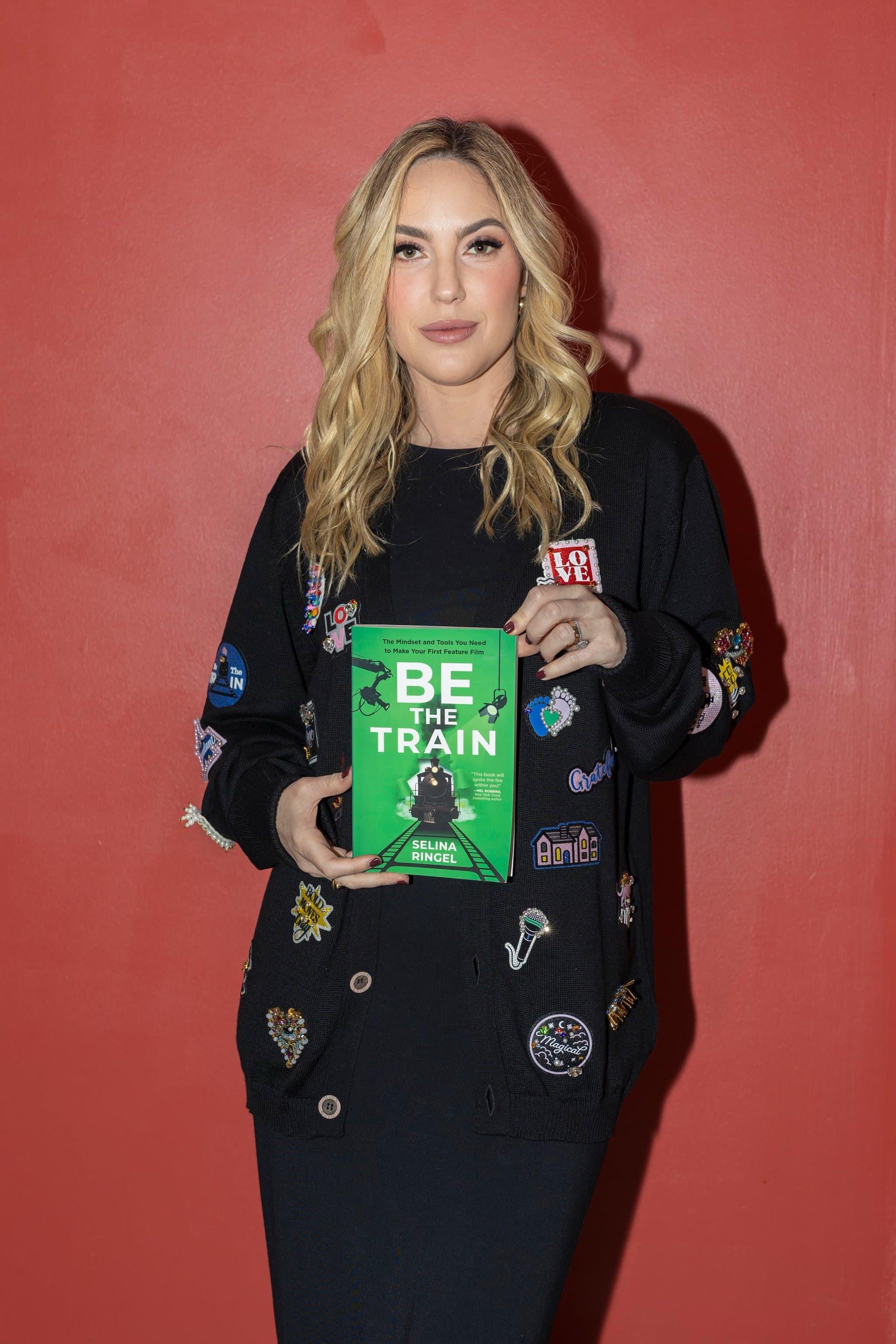 Selina Ringel holding a copy of Be The Train